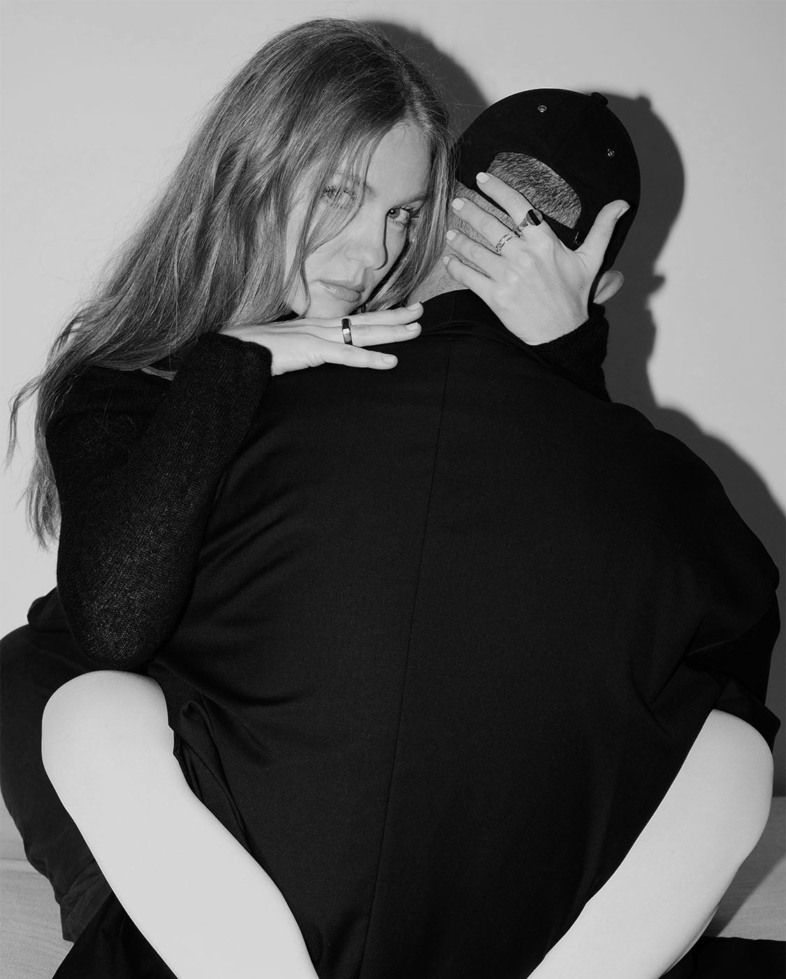Models hugging with legs wrapped around each other’s backs