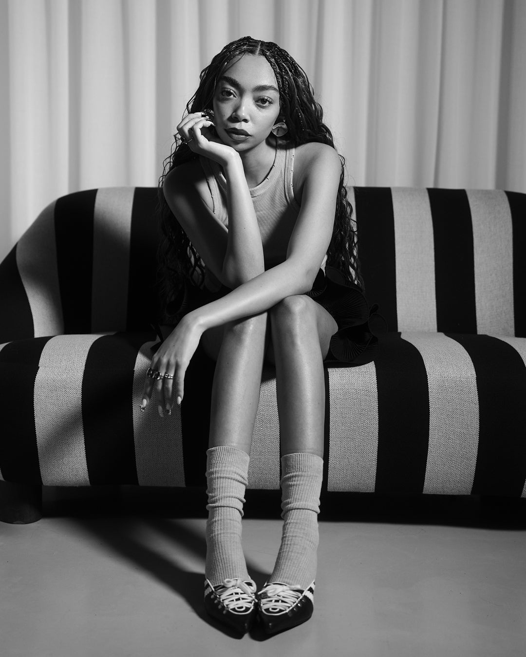 Bree Carter on striped sofa - KINRADEN